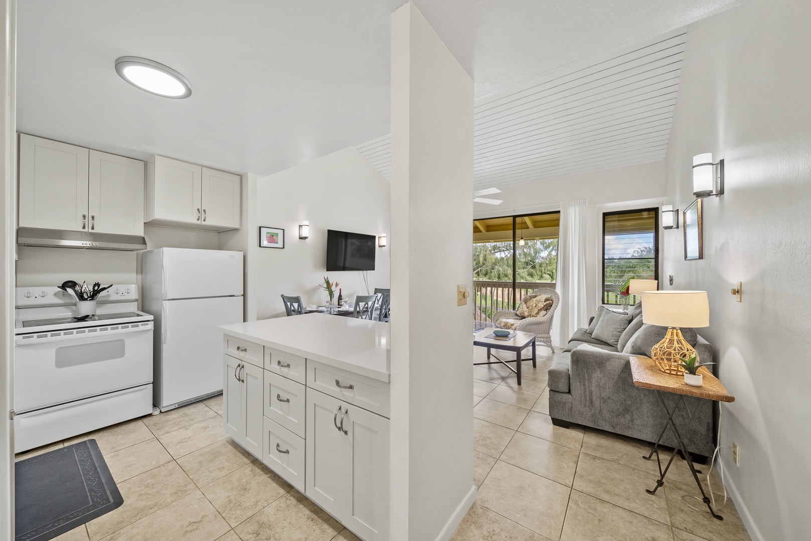 Kahuku Vacation Rentals, Kuilima Estates East #164 - View from the kitchen looking to the lanai and beyond.