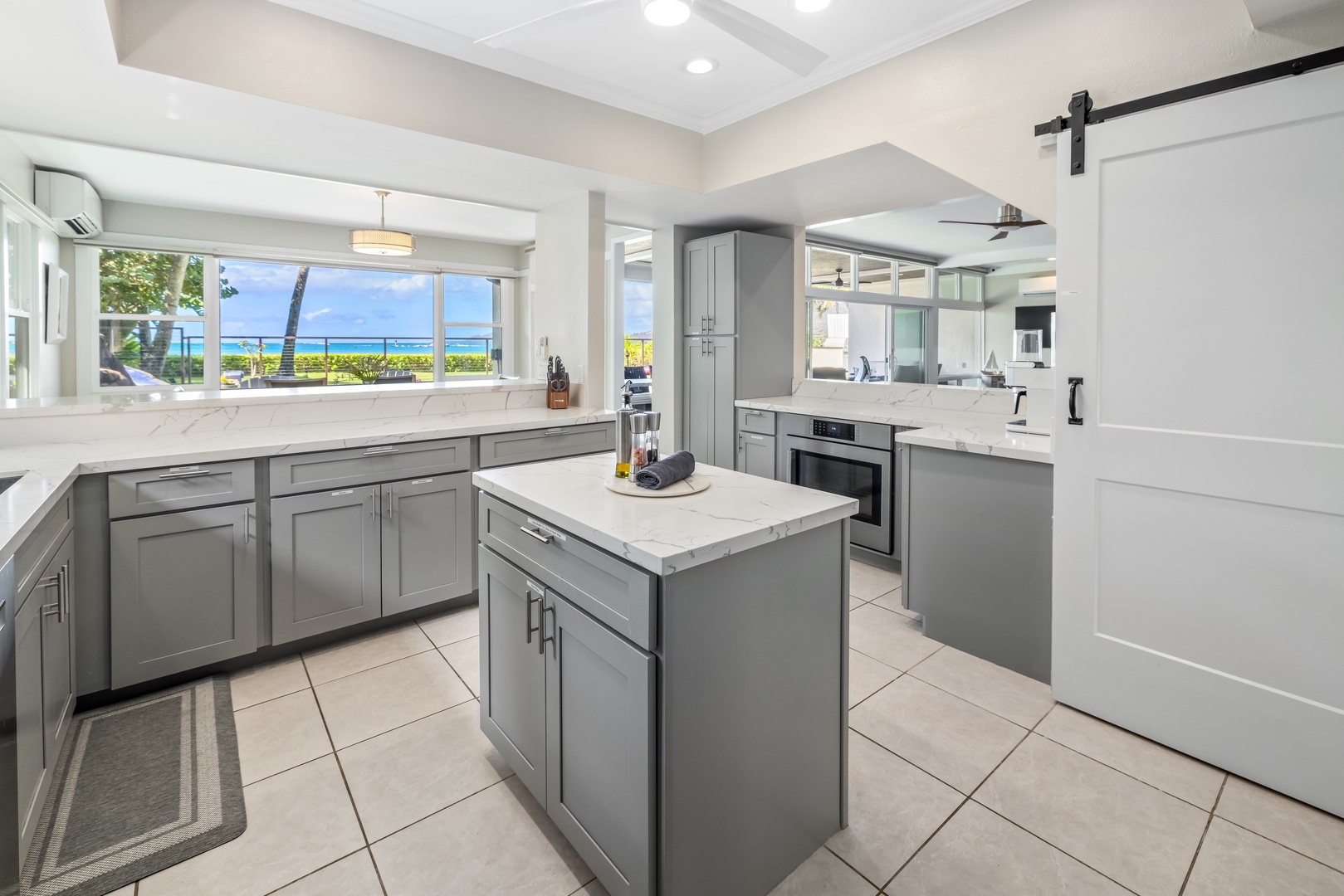 Honolulu Vacation Rentals, Nanea Kai Villa - Conveniently prepare meals on the fully equipped kitchen with ocean views and plenty of counter space.