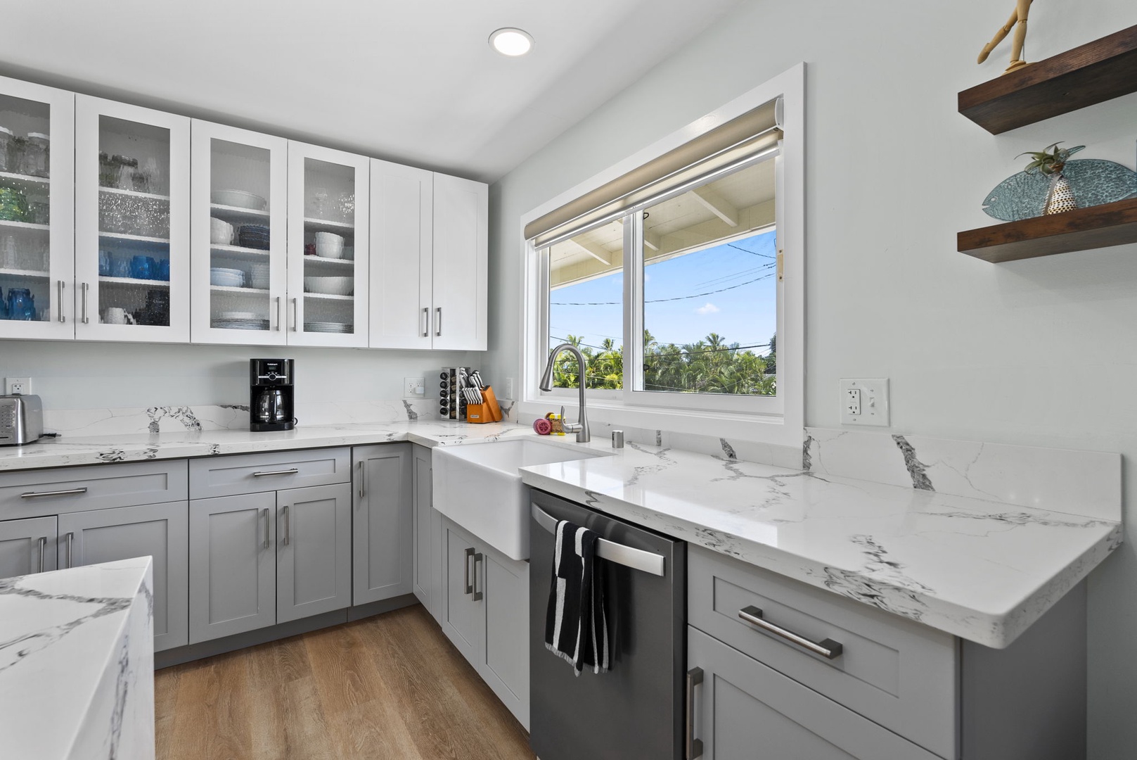 Kailua Vacation Rentals, Hale Alapi'i Lanikai Getaway - This kitchen features a clean, contemporary design with marble countertops and a well-lit window