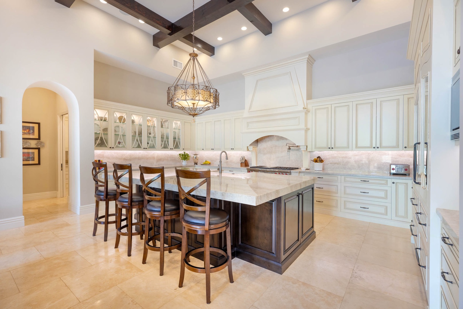 Honolulu Vacation Rentals, The Kahala Mansion - Elegant kitchen island with seating for dining and socializing.