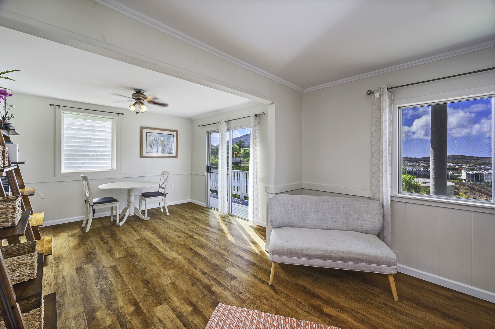 Honolulu Vacation Rentals, Hale Malia - This bedroom opens up to a seating area with small dining table and lounge chair, plus direct access to the deck