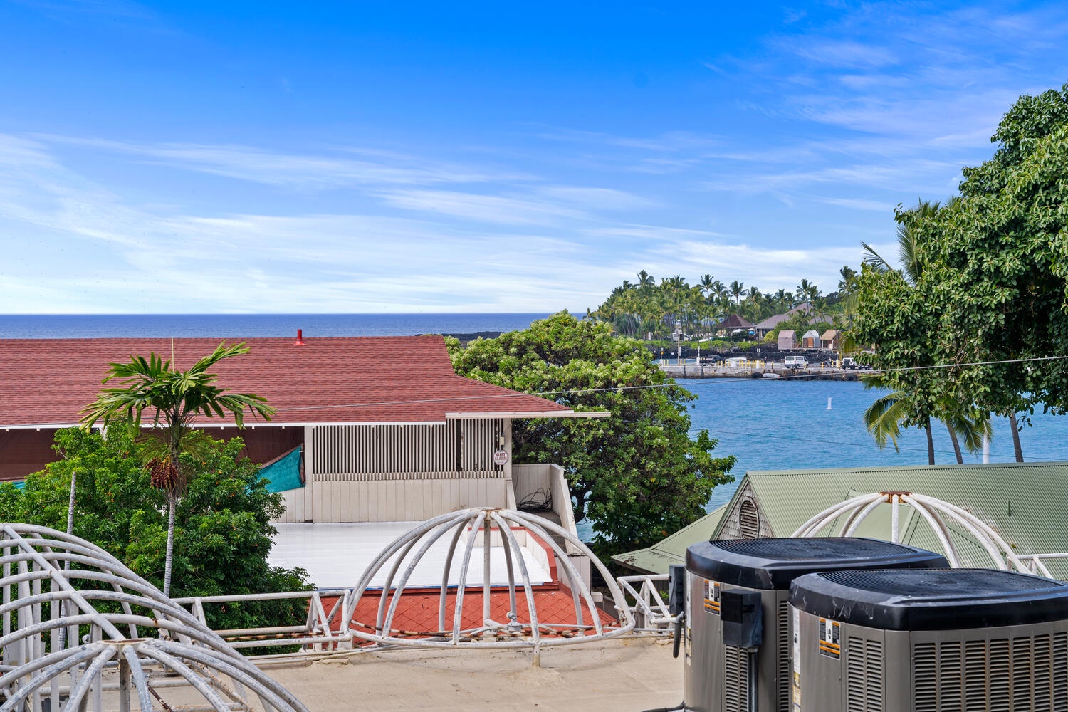 Kailua Kona Vacation Rentals, Kona Plaza 201 - Tropical paradise unfolds with stunning ocean views and lush greenery surrounding this coastal retreat.