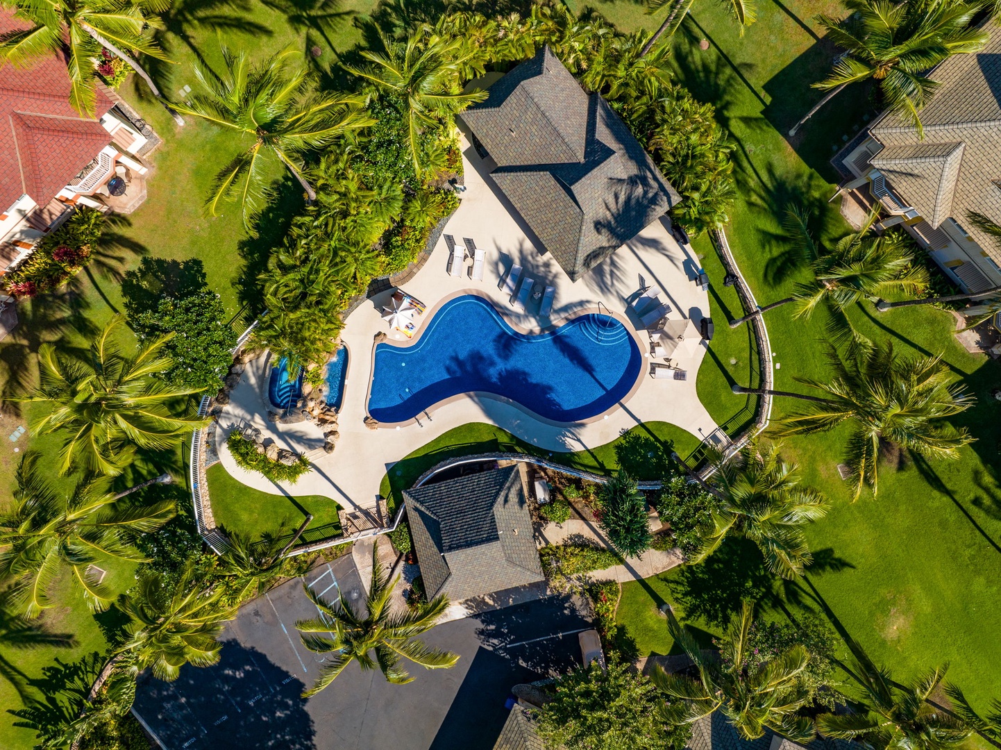 Kapolei Vacation Rentals, Kai Lani Luxury 6D - Aerial view of the community pool and landscaped grounds, providing a secluded space to relax and unwind.