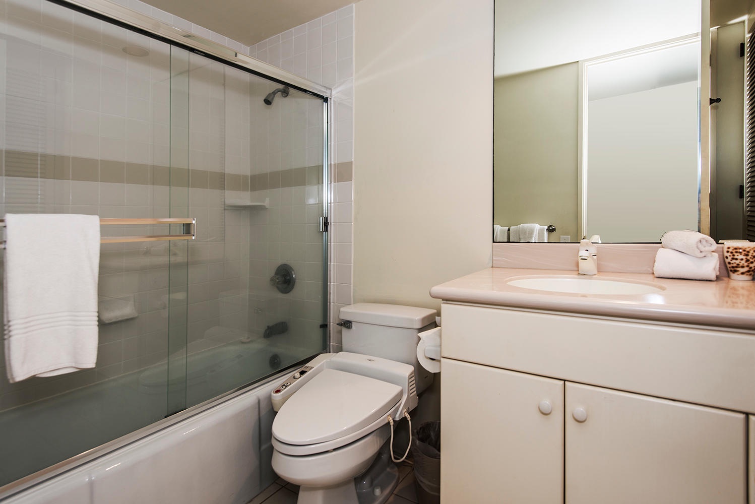 Honolulu Vacation Rentals, Kahala Beachfront Villa - The shared bathroom has a shower/tub combo and a single vanity area.