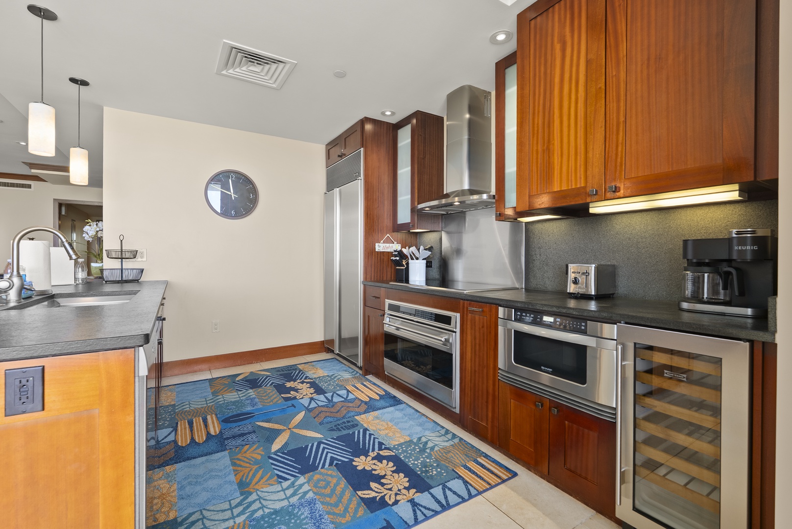 Kapolei Vacation Rentals, Ko Olina Beach Villas O1404 - Dark counters and full-size stainless, room to spread out a whole meal's prep.