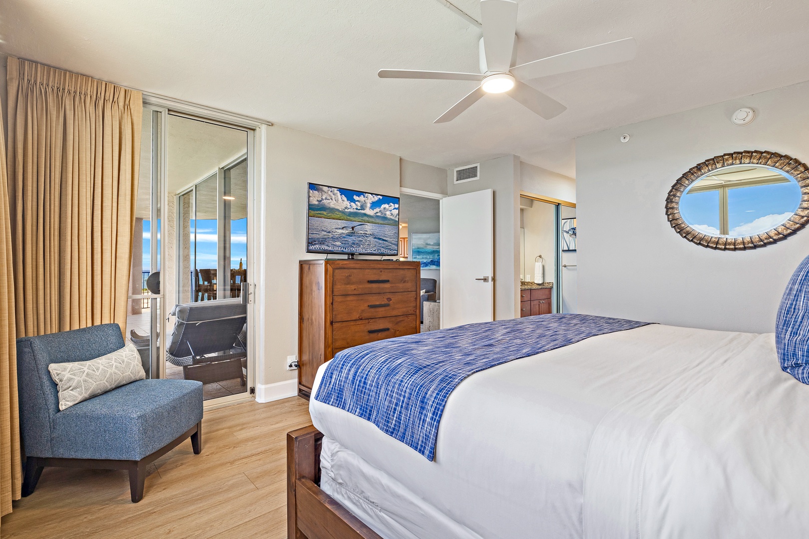 Lahaina Vacation Rentals, Royal Kahana 1010 - This spacious bedroom features comfortable bedding, modern decor, and direct access to a private lanai for added relaxation.