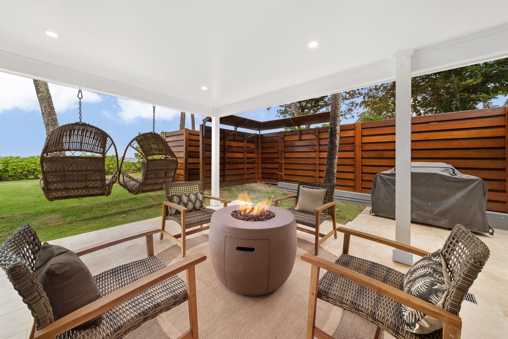 Haleiwa Vacation Rentals, Hale Nalu - Fire pit with covered lanai and outdoor furniture