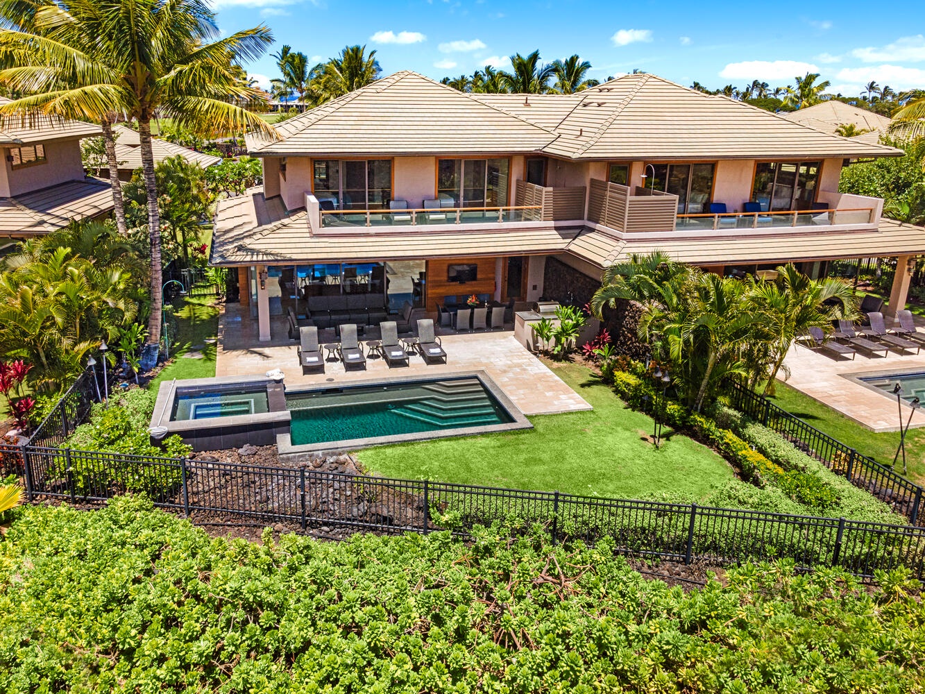 Kamuela Vacation Rentals, Laule'a Ohana Retreat - Aerial view of the villa showcasing private pool, lush lawn, and covered lanai at Laule'a #14.