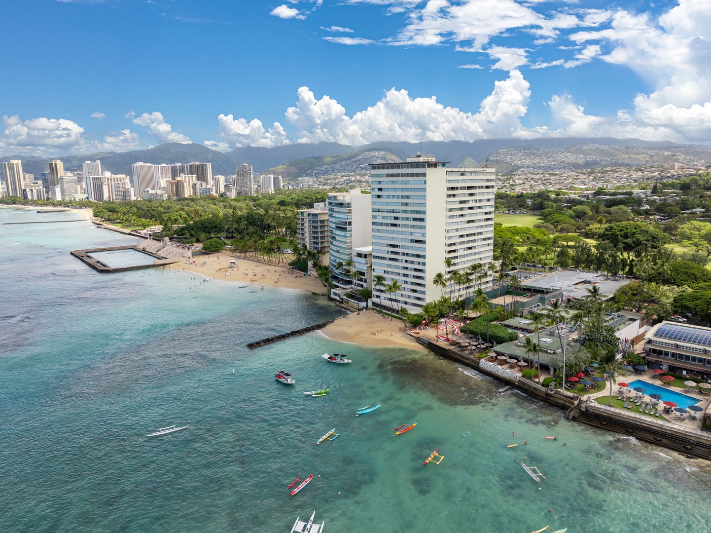 Honolulu Vacation Rentals, Colony Surf Getaway - Stunning aerial shot of the property, showcasing beachfront living and breathtaking ocean views.