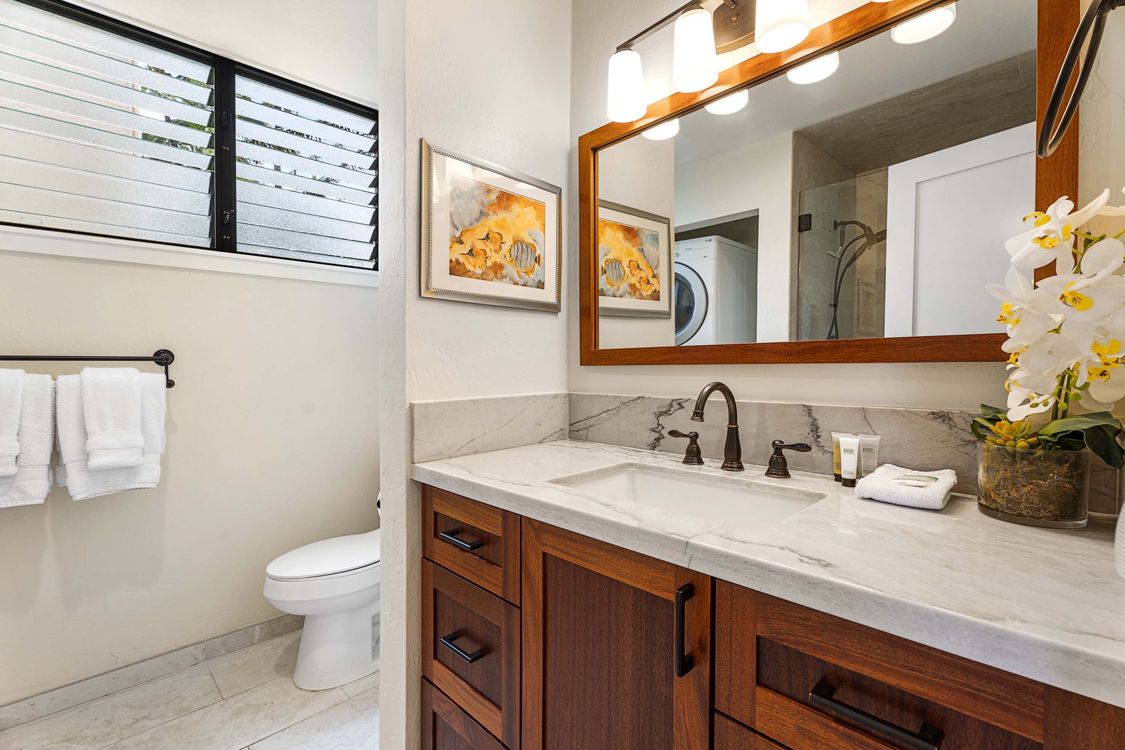 Kailua Kona Vacation Rentals, Keauhou Kona Surf & Racquet 2101 - The attached ensuite is nicely updated and includes a shower and a convenient full-size washer and dryer.