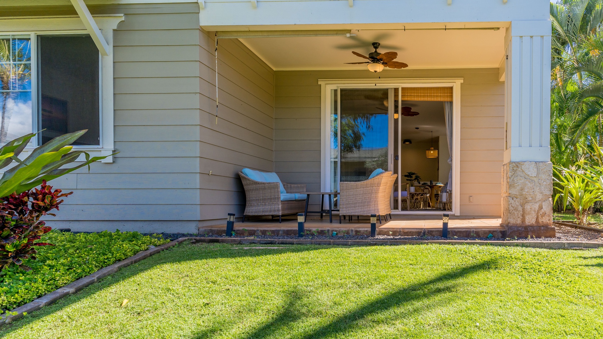 Kapolei Vacation Rentals, Ko Olina Kai 1033A - Dine on the lanai under swaying palm trees.