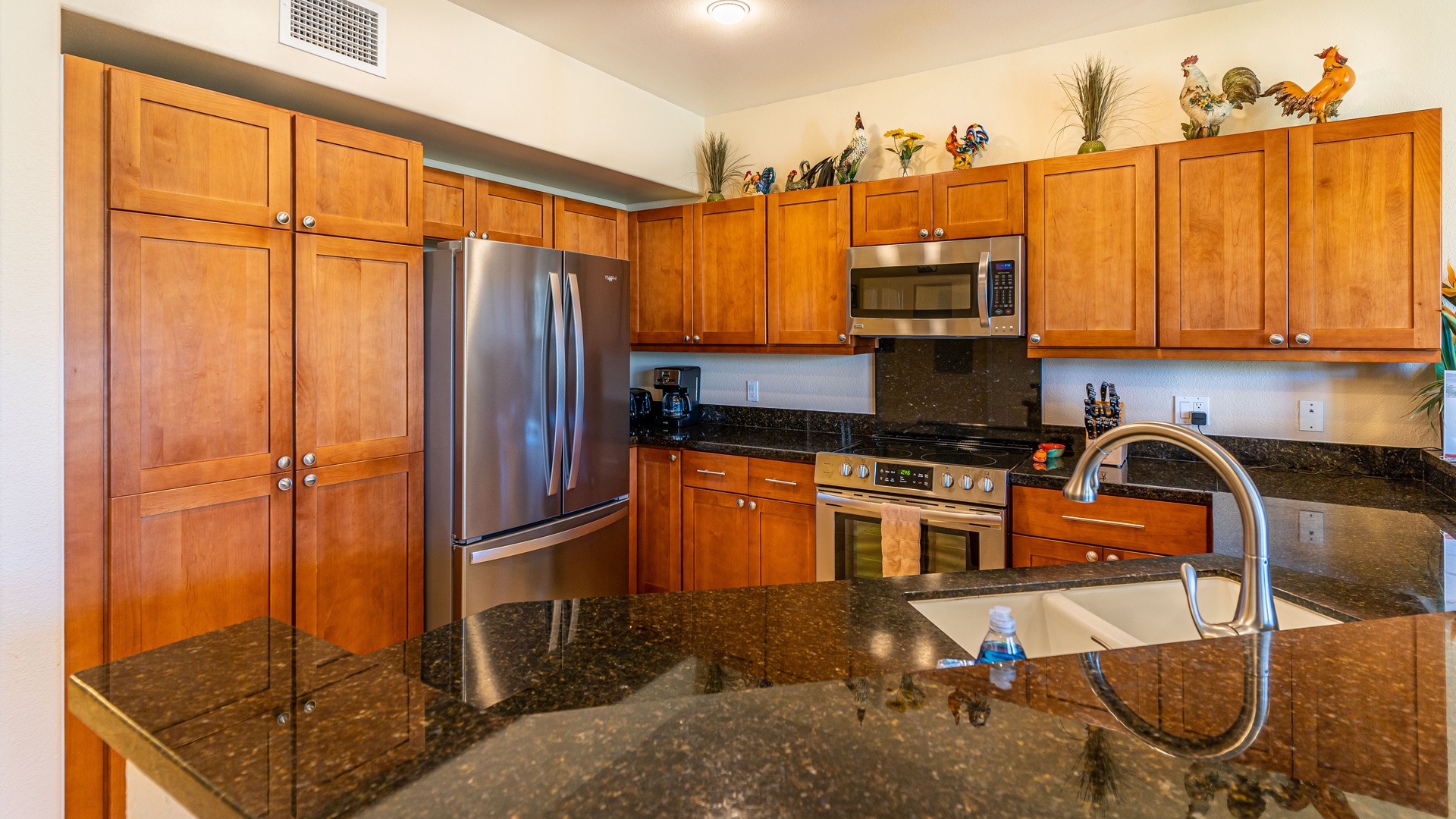 Kapolei Vacation Rentals, Ko Olina Kai 1033C - The kitchen features stainless steel appliances and numerous amenities.