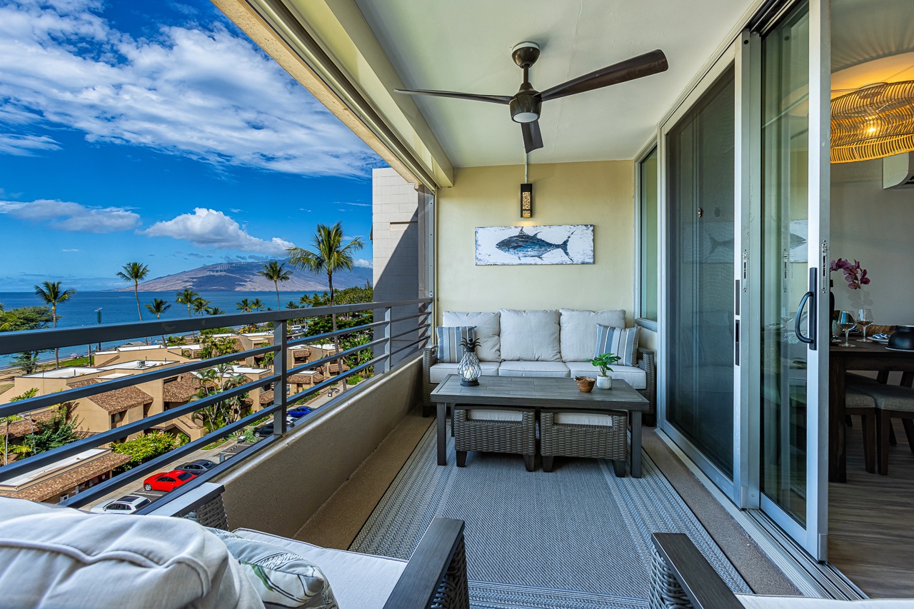 Kihei Vacation Rentals, Kamaole Beach Royal 610 - A wicker sofa and coffee table make this end of the lanai the spot to watch the evening light change.