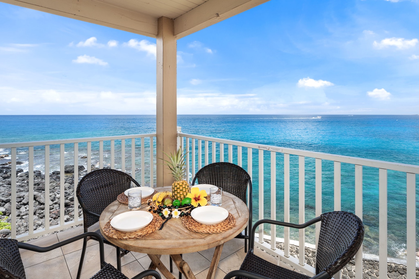 Kailua Kona Vacation Rentals, Sea Village 4213 - Oceanfront lanai dining—share a meal with unbeatable views of Kailua Bay and the sparkling Pacific horizon.