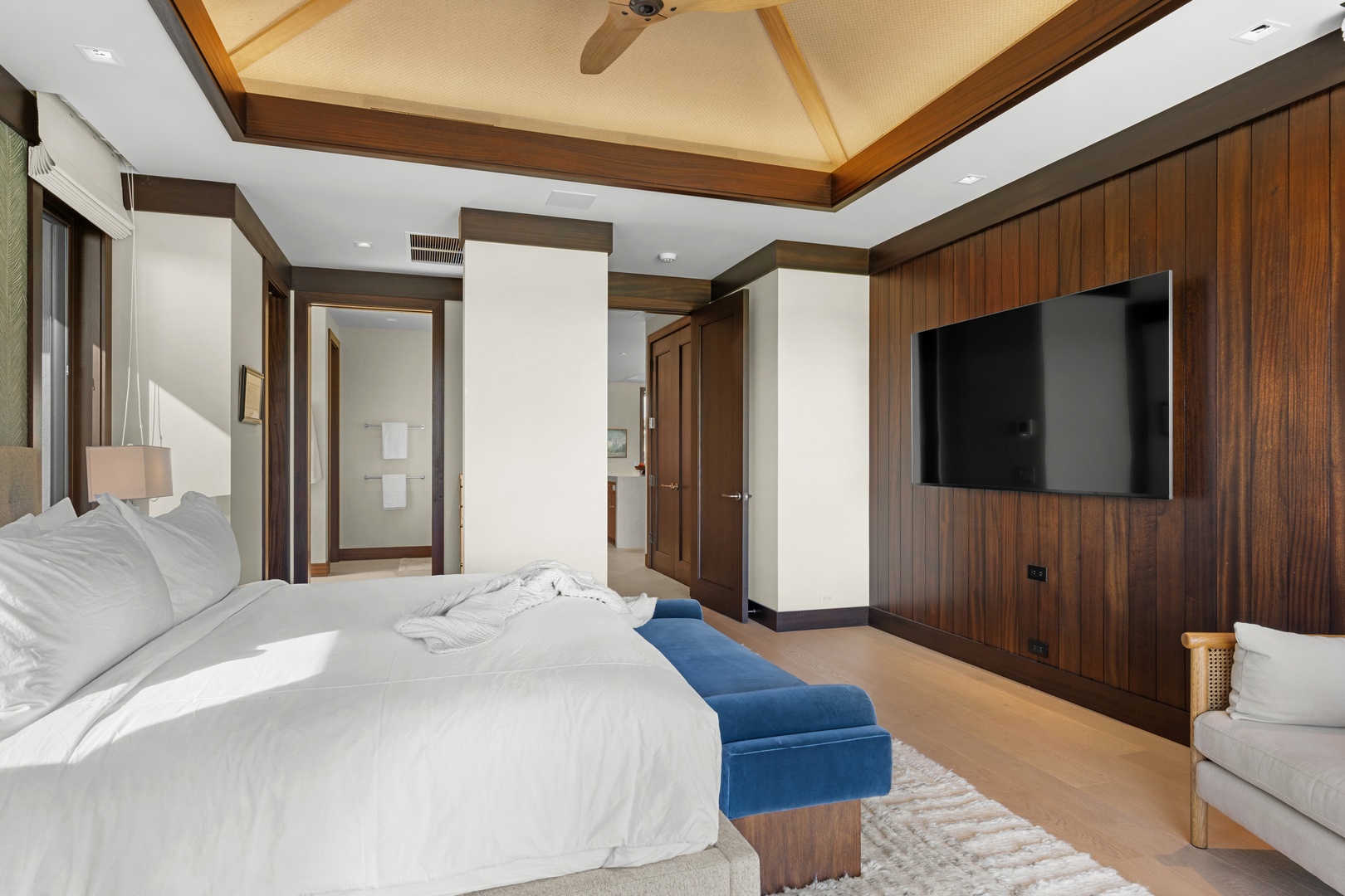 Kailua-Kona Vacation Rentals, 4BD Ka'Ulu Estate (102A) at Hualalai Resort - Primary Suite #2: Unwind in your elegant bedroom with rich wood accents and soaring coffered ceilings.