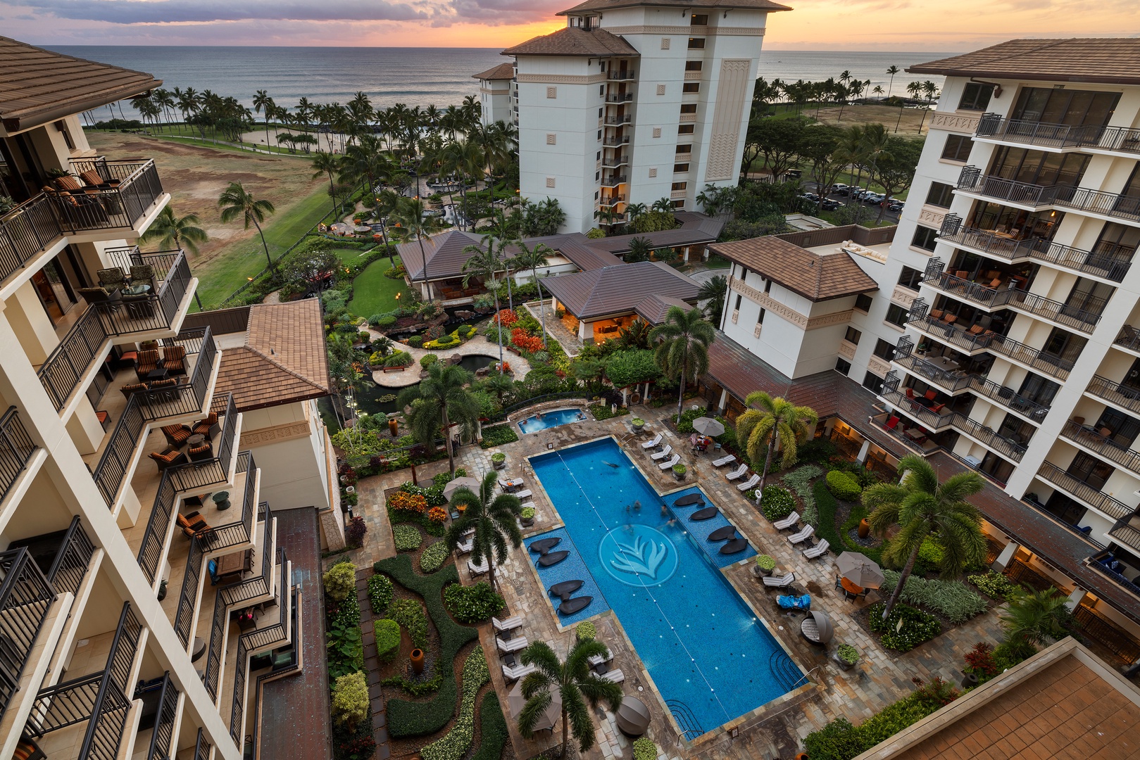 Kapolei Vacation Rentals, Ko Olina Beach Villas O1006 - Resort pool view from the lanai with a glimpse of the ocean