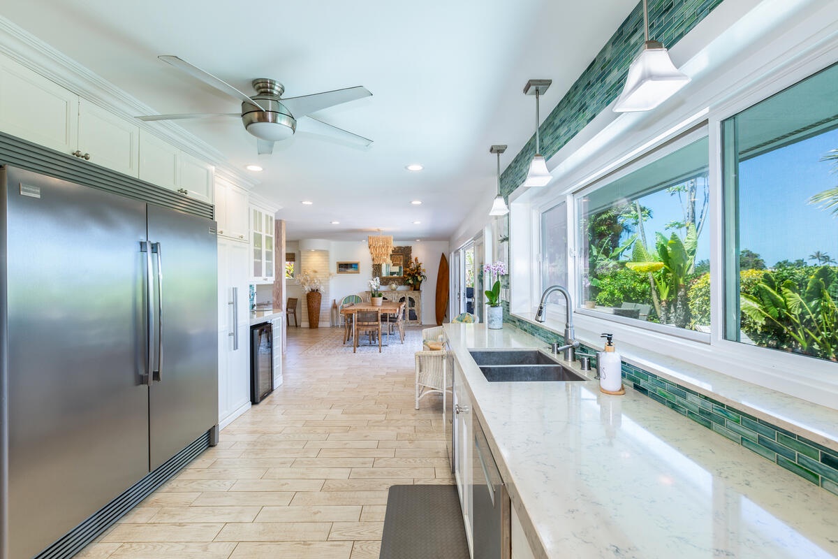 Princeville Vacation Rentals, Hokulani Villa - The kitchen seamlessly connected to the living and dining areas—ideal for entertaining guests or family gatherings.