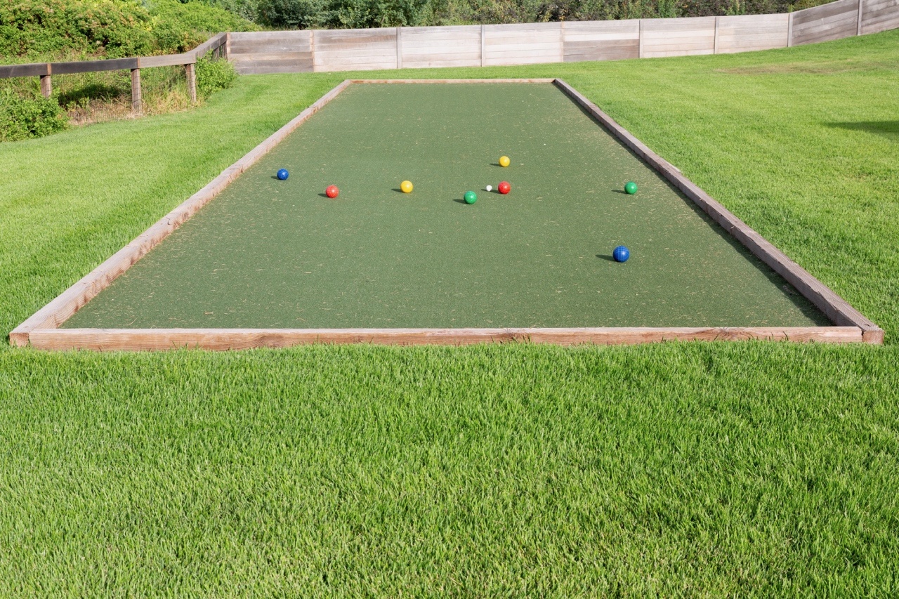 Kamuela Vacation Rentals, Puako’s Ocean Edge Modern Estate - Bocce court framed by manicured lawn—game-ready and sun-lit.