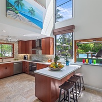 Kailua Vacation Rentals, Kailua Shores Estate 5 Bedroom - Pool House chef’s kitchen and bar with modern appliances and a breakfast counter seating 3.