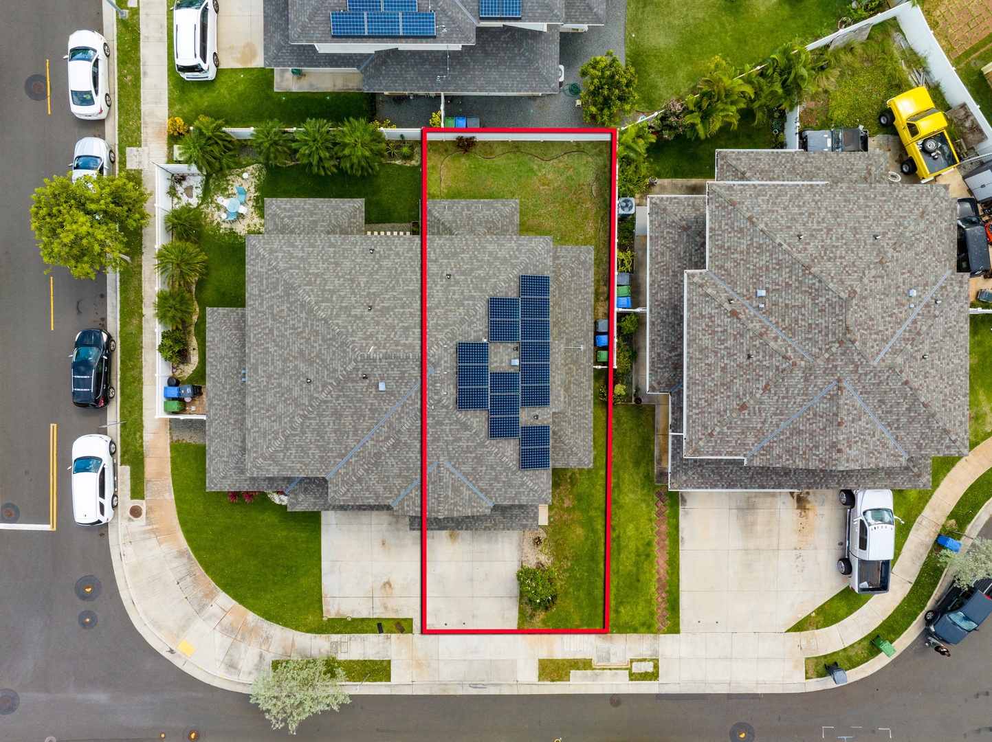 Kapolei Vacation Rentals, Kilipue Retreat - Aerial view of the home showcasing solar panels and fenced backyard.