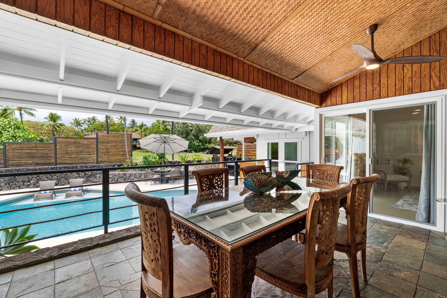 Kailua Kona Vacation Rentals, Manukai Hale - Pull up a chair at the Lanai table with the pool framed in the windows behind you.