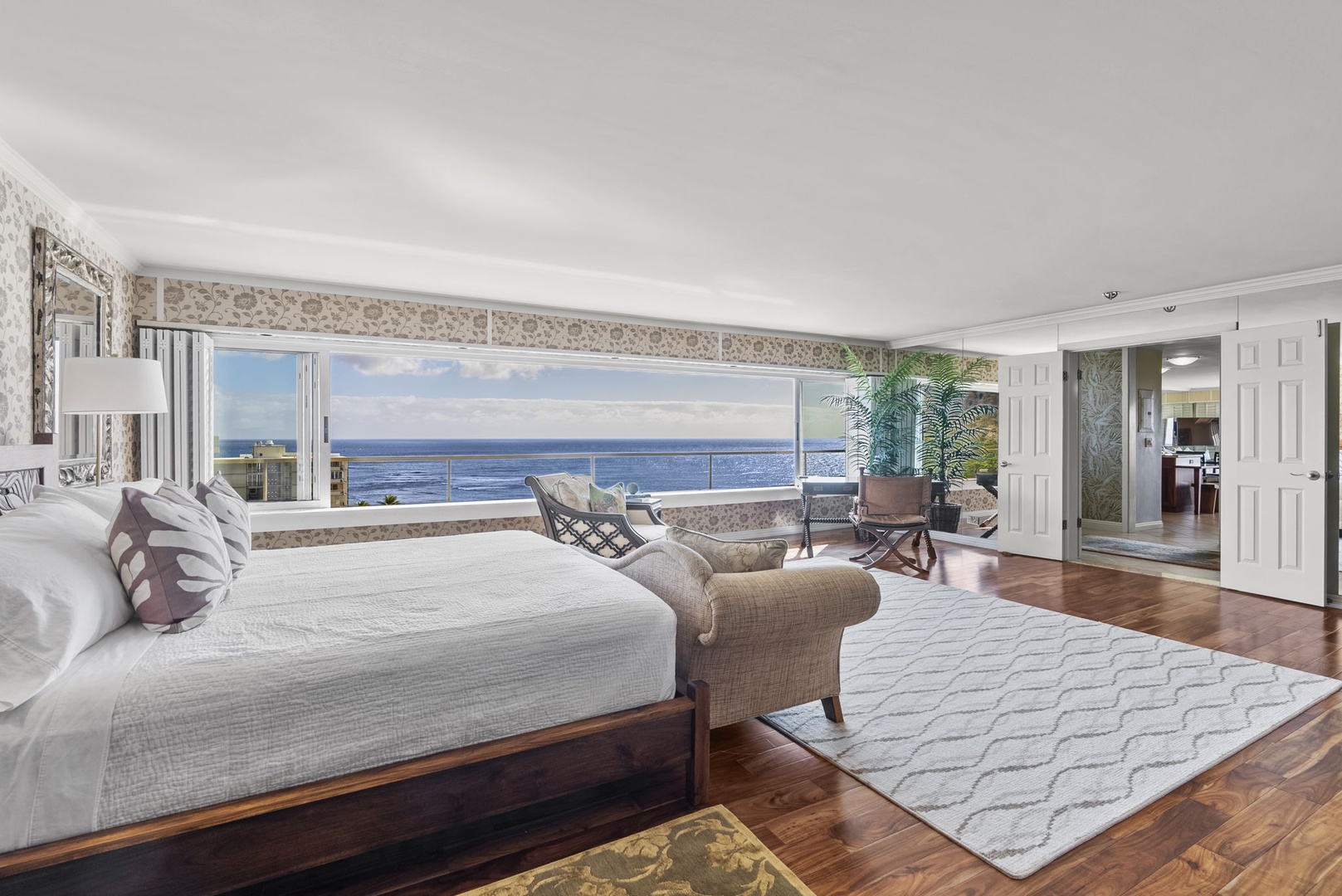 Honolulu Vacation Rentals, Hale Kaimana - Spacious primary bedroom with a king-size bed and breathtaking panoramic views.