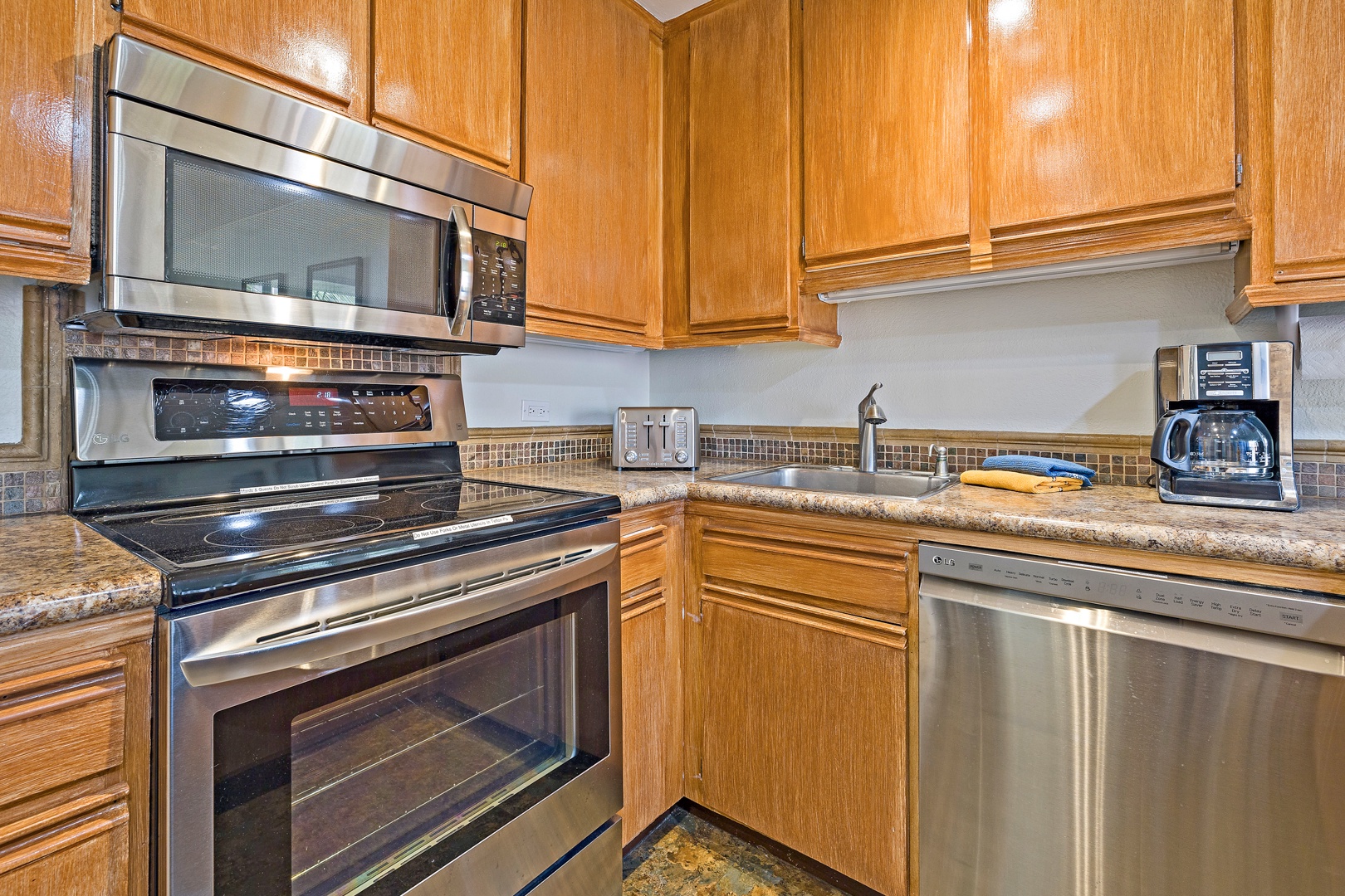 Lahaina Vacation Rentals, Kaanapali Shores 544 - The fully equipped kitchen features stainless steel appliances and ample cabinetry, perfect for preparing delicious meals during your vacation.