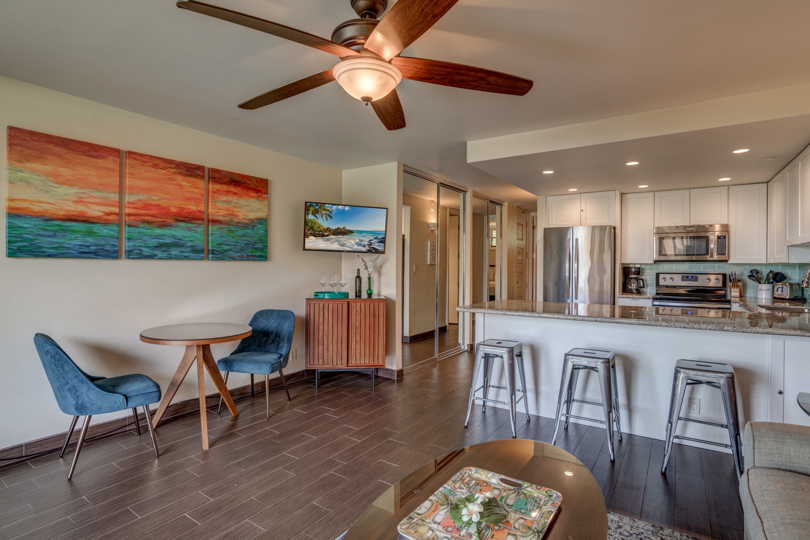 Lahaina Vacation Rentals, Papakea B-105 - The open-concept living area flows seamlessly into the kitchen, featuring comfortable seating and a cozy dining nook perfect for enjoying meals