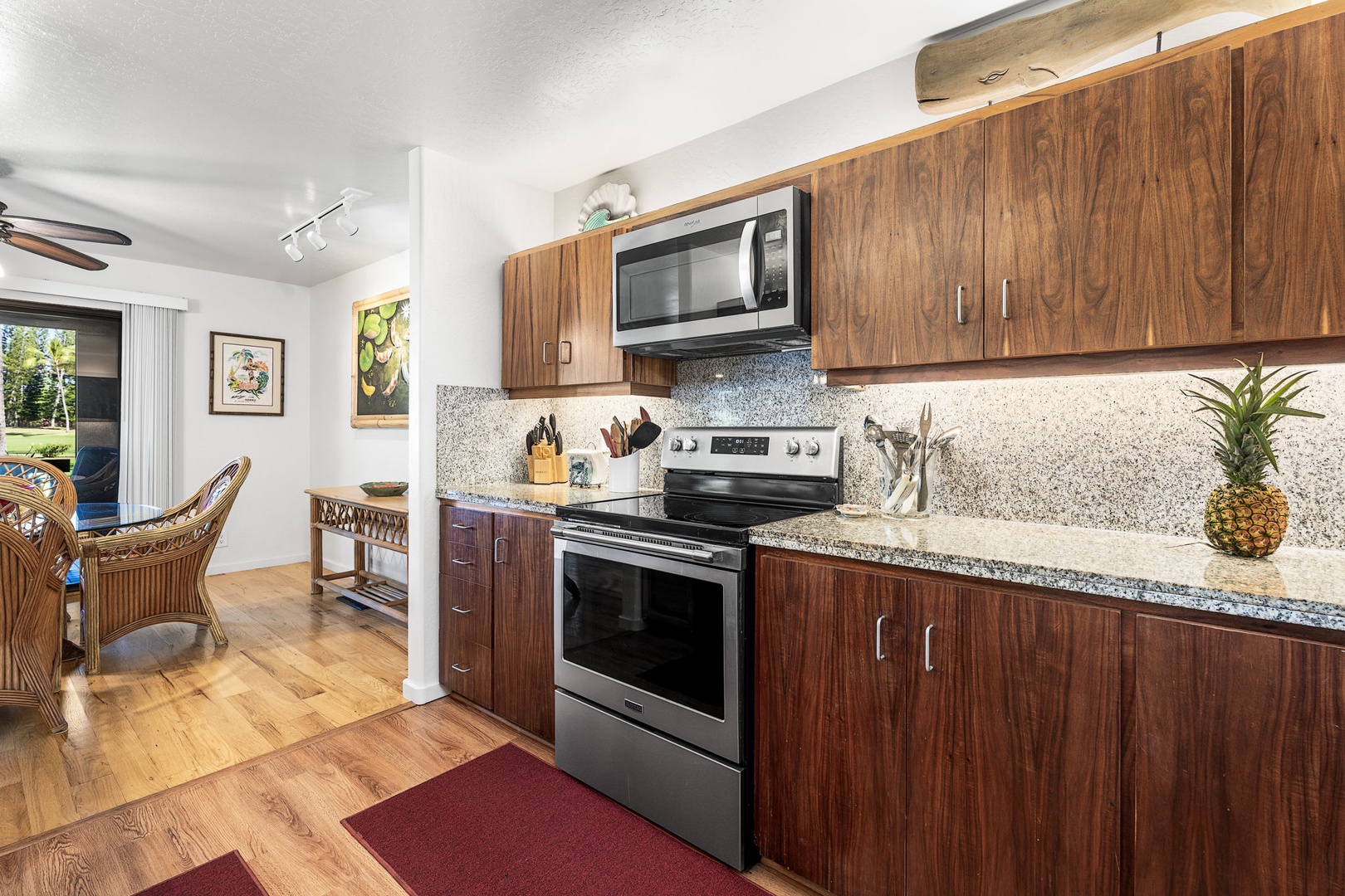 Kailua Kona Vacation Rentals, Kanaloa at Kona 701 - Your fully equipped kitchen features warm Koa wood cabinets, granite counters, and stainless appliances—perfect for preparing tropical meals.