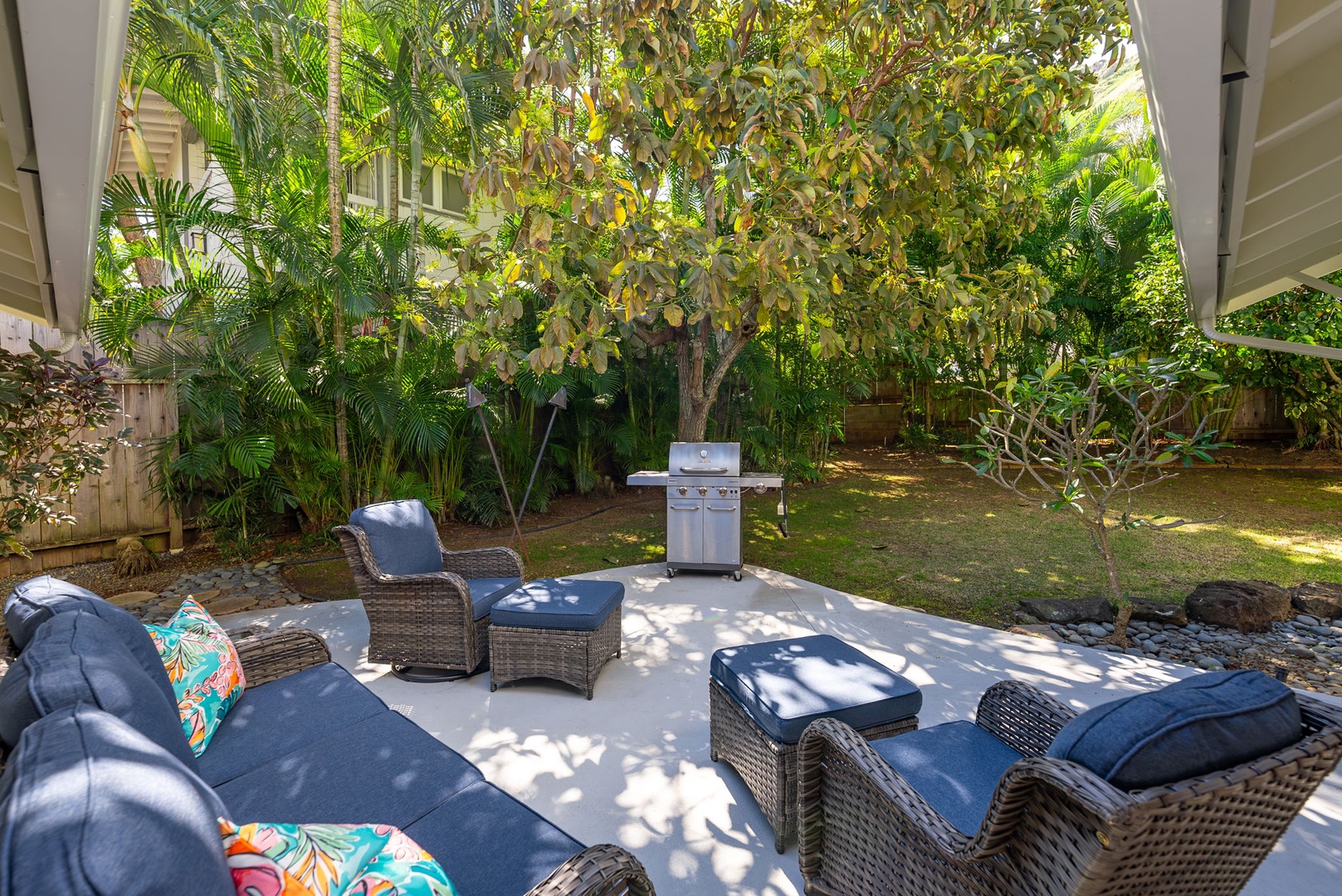 Kailua Vacation Rentals, Nohie Lanikai - Unwind in the shaded outdoor lounge area, surrounded by lush greenery.