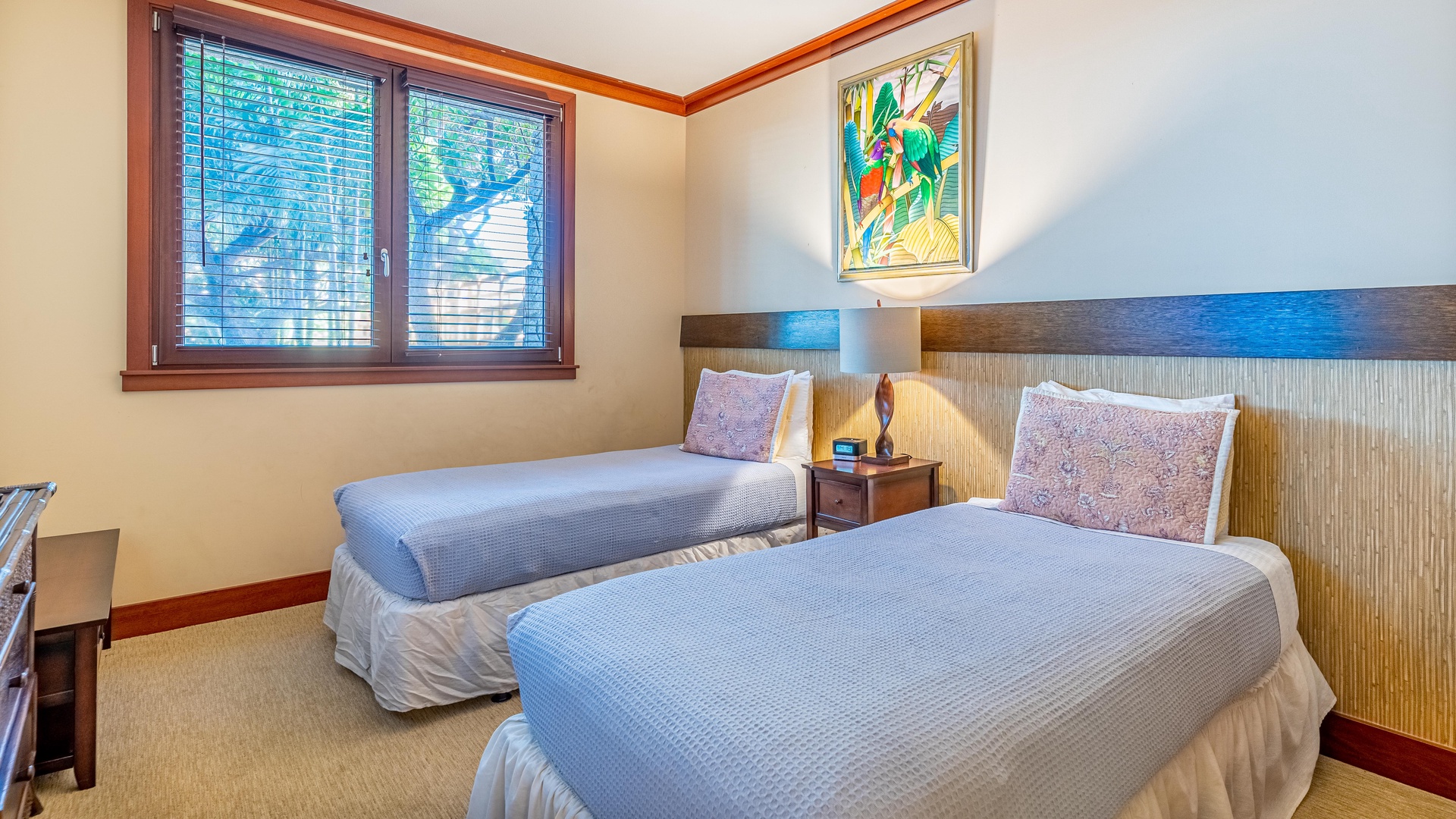 Kapolei Vacation Rentals, Ko Olina Beach Villas B102 - The second guest bedroom with twin beds, dresser, TV, and nightstand in the middle of both beds.
