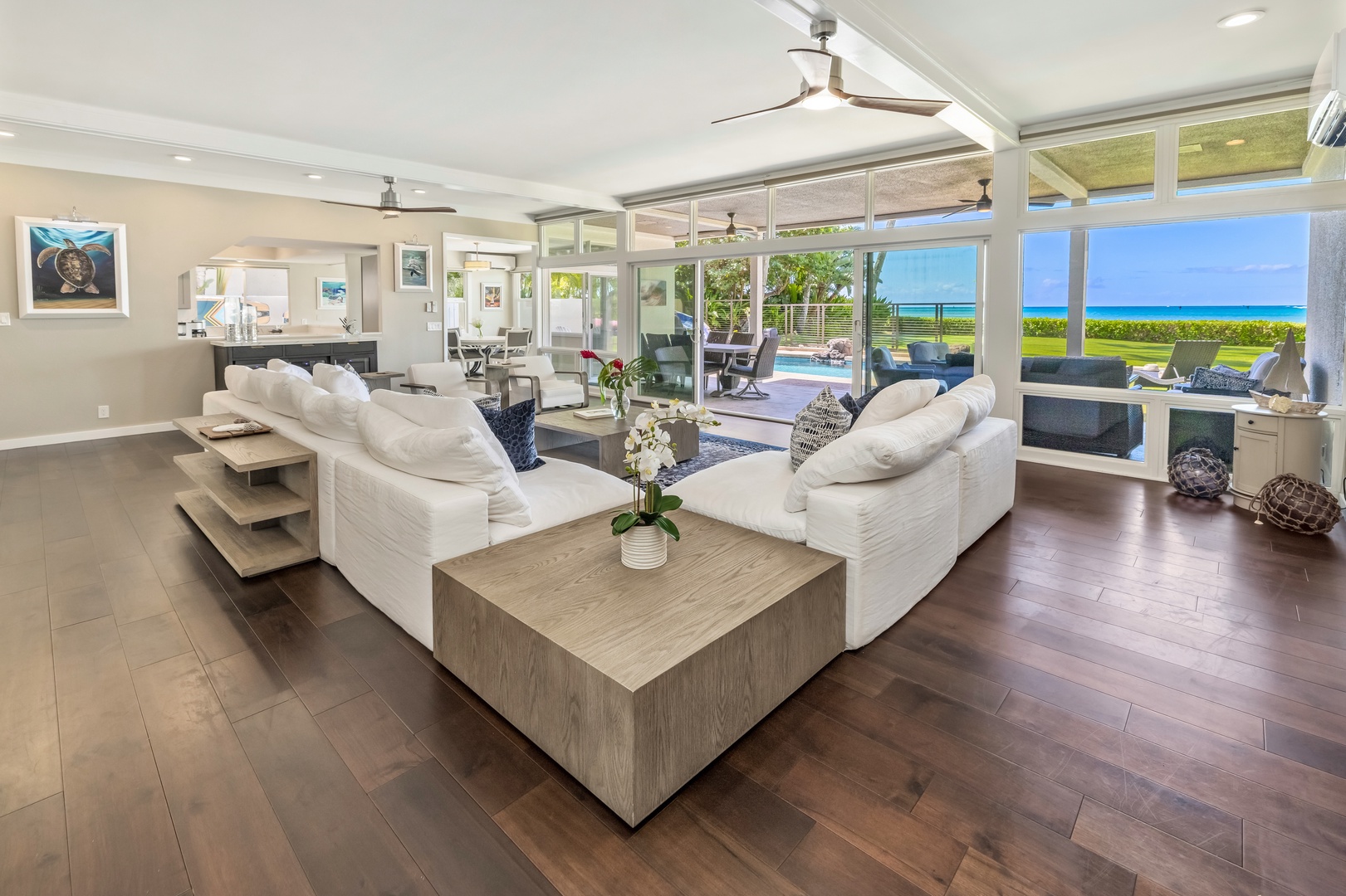 Honolulu Vacation Rentals, Nanea Kai Villa - The elegant living area has modern decor, ocean views, and direct patio access.