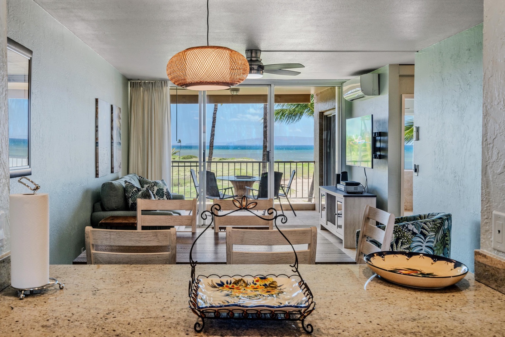 Kihei Vacation Rentals, Menehune Shores 420 - Stand at the kitchen counter and the ocean fills the glass straight across the living room.