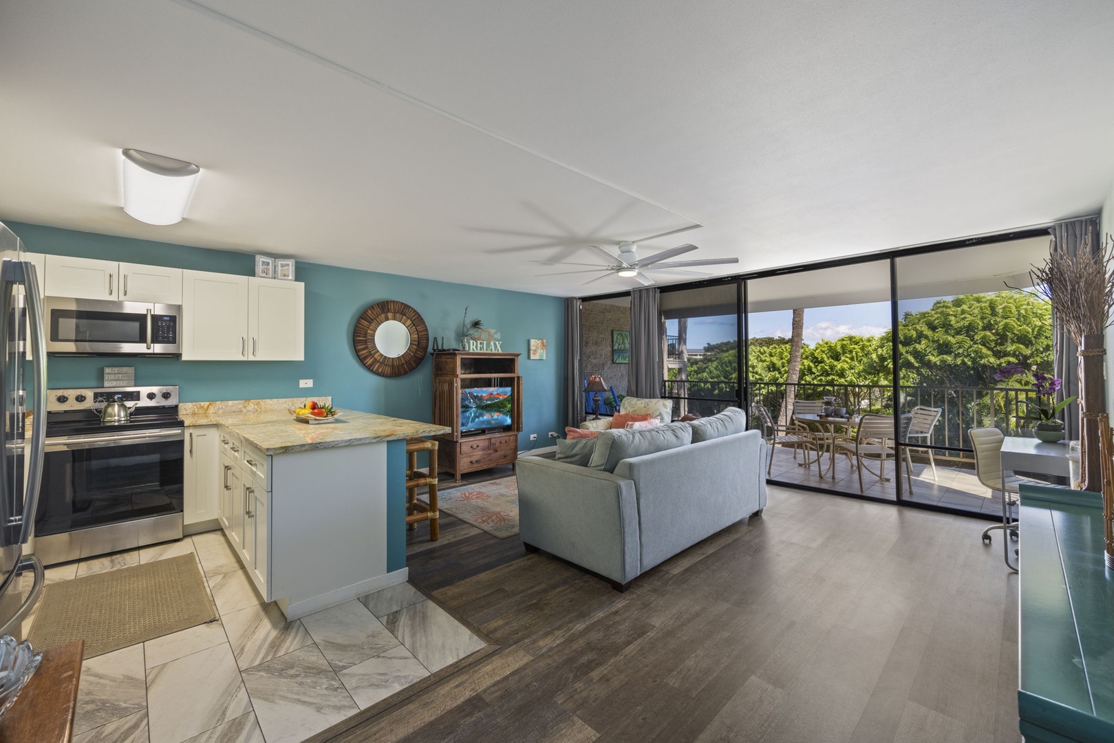 Kihei Vacation Rentals, Kihei Alii Kai C206 - The kitchen, sofa, and lanai share one bright room, so no one's ever off on their own.