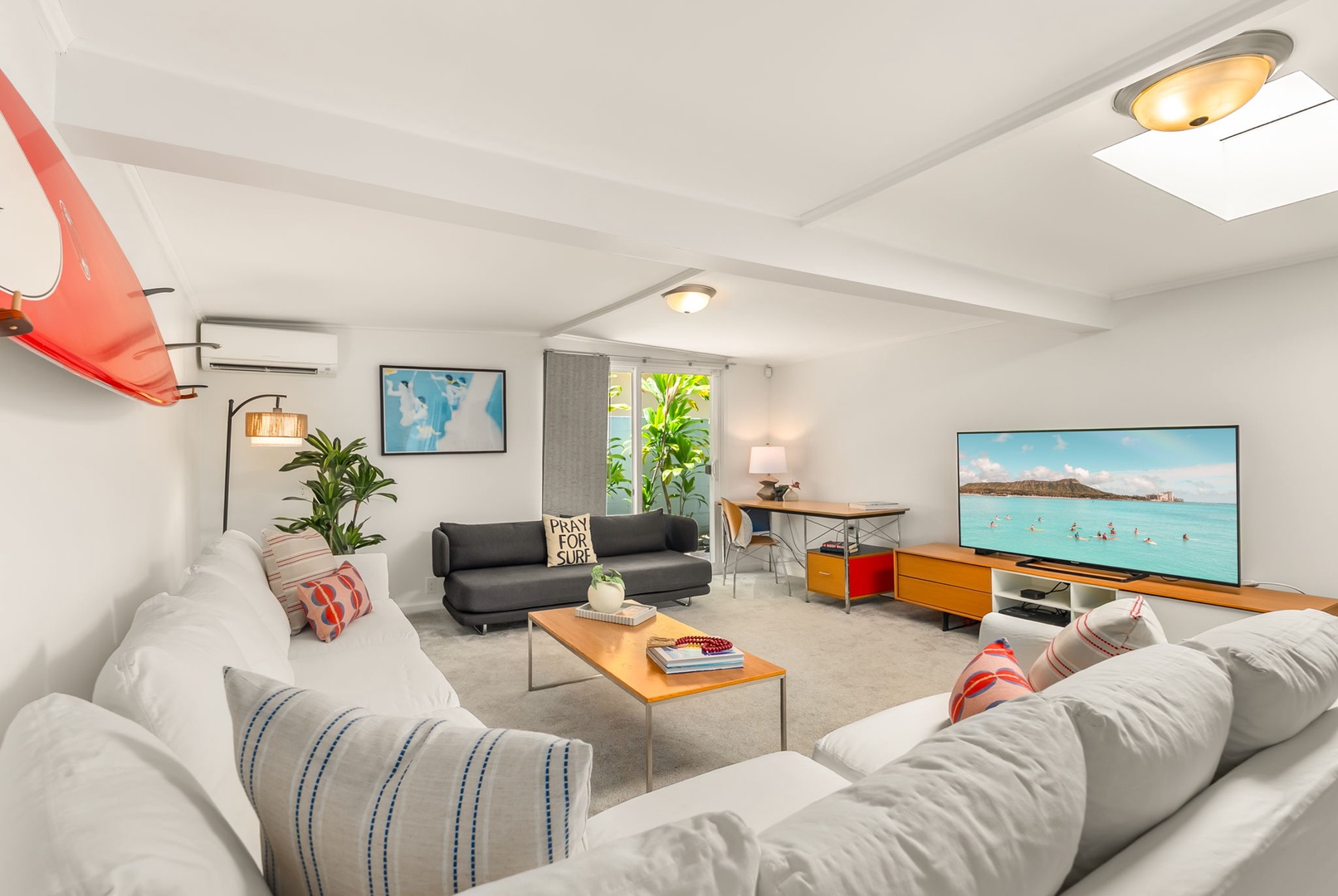 Honolulu Vacation Rentals, Ho'okipa Villa - Unwind in your bright, airy living room with plush seating, skylights, and a large TV perfect for movie nights after beach days.
