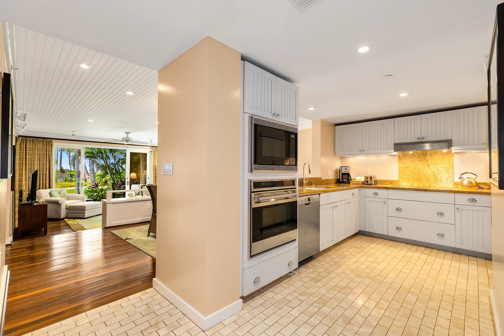 Kahuku Vacation Rentals, Turtle Bay Villas 112 - Do dishes with a clear view into the dining area and out into the beautifully landscaped garden.