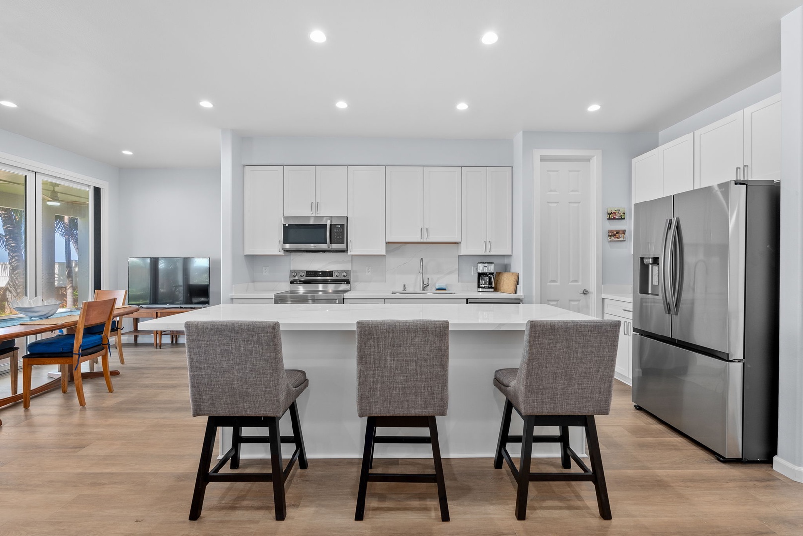 Waianae Vacation Rentals, Oceanfront Luxury Dream Estate - Bright and inviting kitchen with high-top bar seating and direct lanai access.