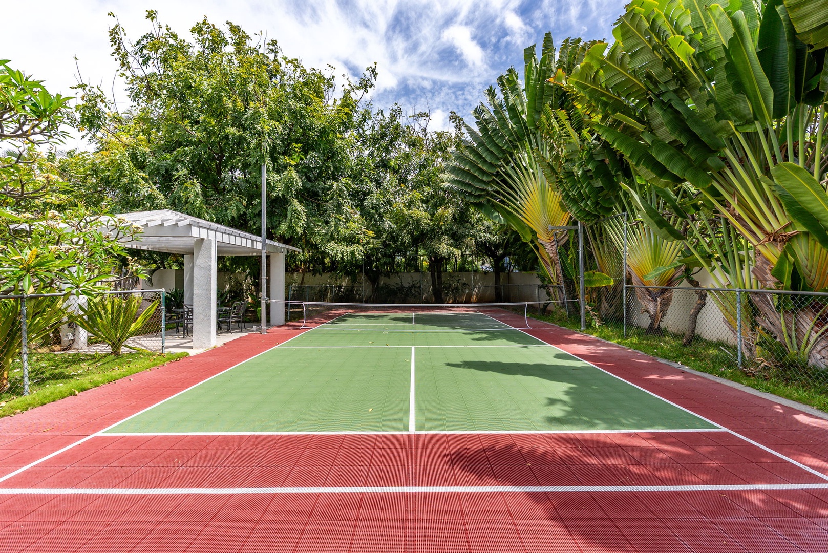 Honolulu Vacation Rentals, Paradise Beach Estate - Challenge your guests to a game on the estate’s private pickleball court—tucked among tropical foliage for shaded play.
