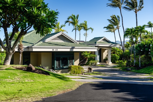 Kamuela Vacation Rentals, Canoe House & Beach Walker at Champion Ridge - Charming tropical home with a well-maintained exterior, surrounded by lush greenery and palm trees.