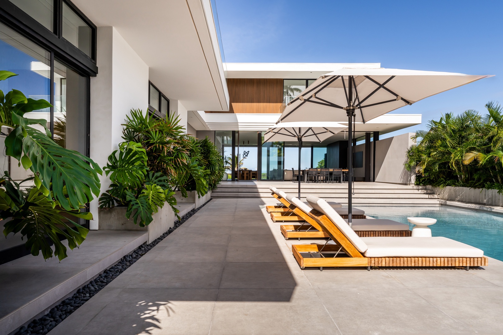 Kailua Vacation Rentals, Kailua Beach Escape - Follow the sun across the terrace, where shaded lounges and open spaces encourage you to slow down.