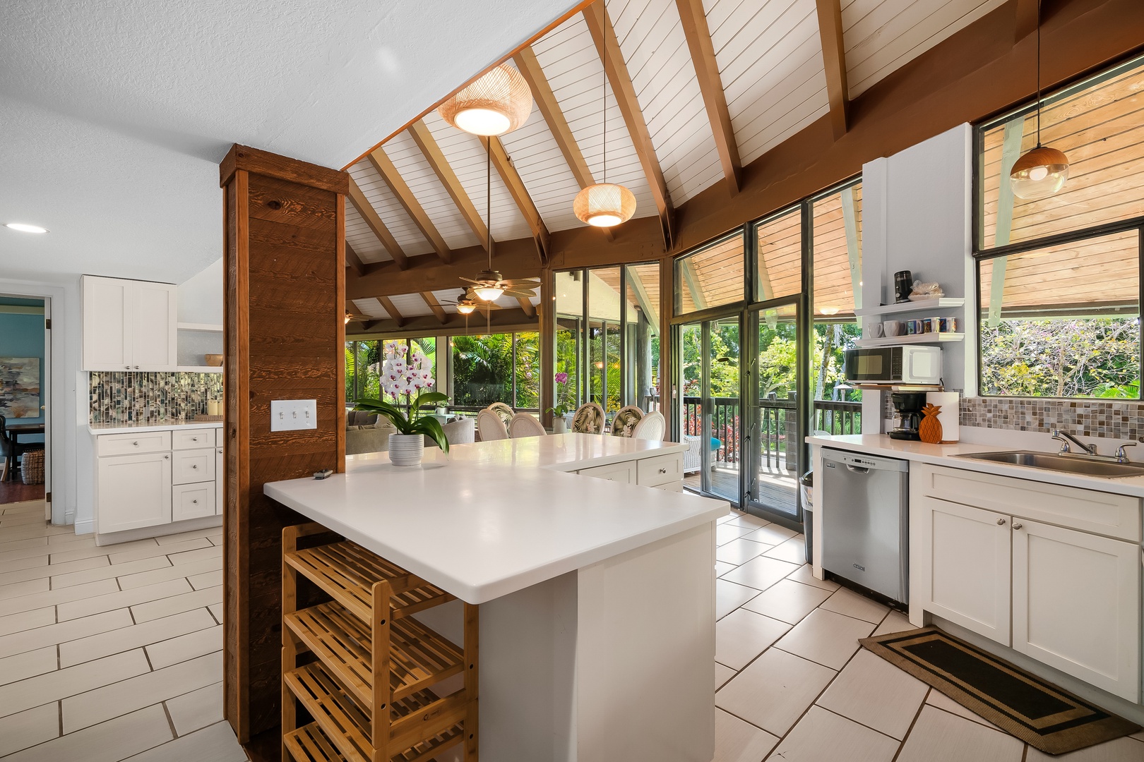 Princeville Vacation Rentals, Mauna Kai 7B - Slide the doors open and the kitchen spills straight onto the lanai.