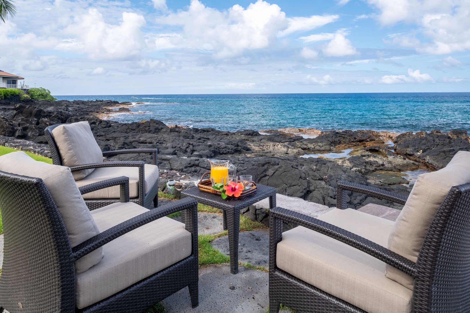 Kailua Kona Vacation Rentals, Kona Beach Bungalows** - Unwind in the Ocean Front lounge, where the gentle sea breeze meets unparalleled views.