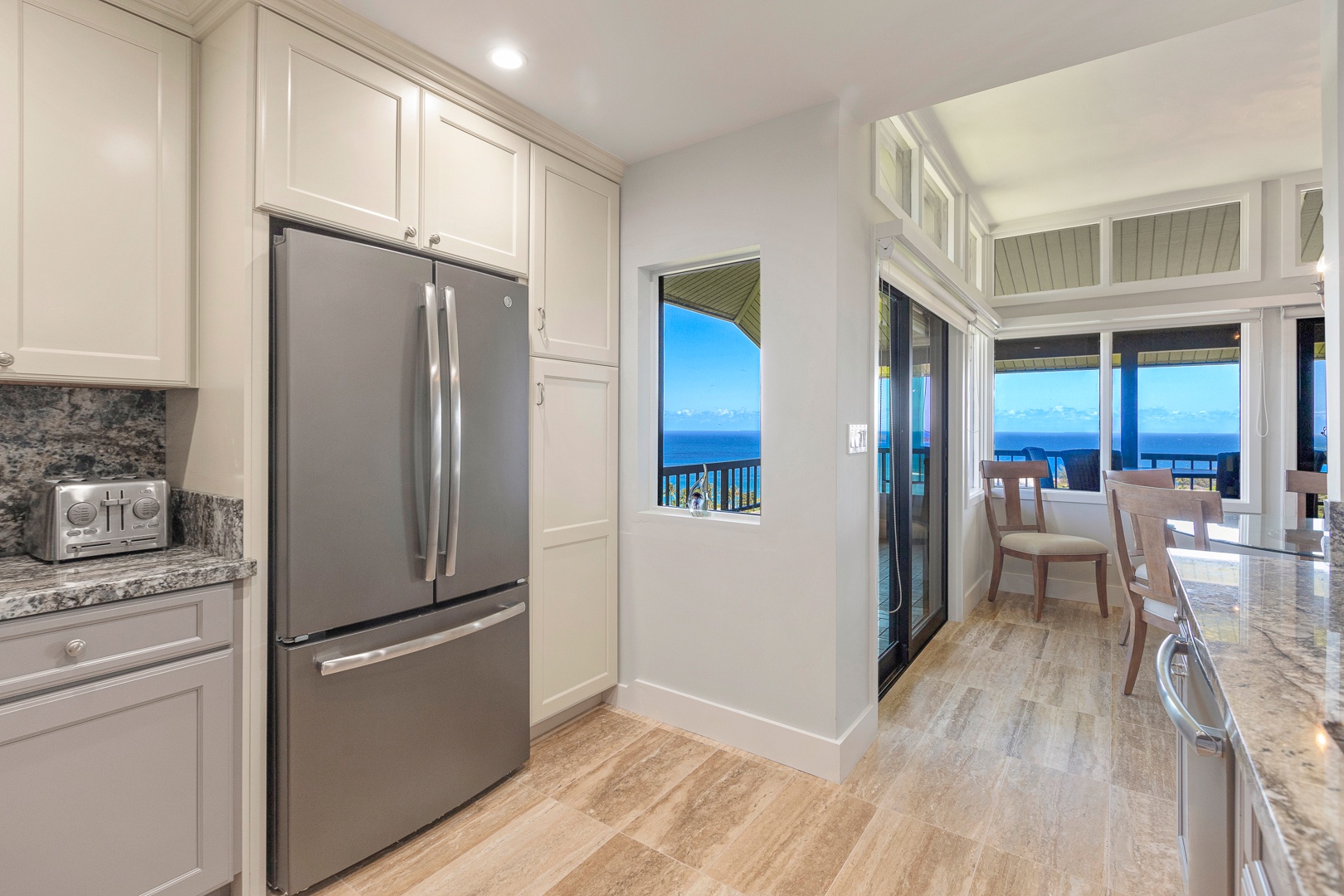 Lahaina Vacation Rentals, Kapalua Ridge 1622 - The kitchen not only features high-end stainless-steel appliances but also offers stunning ocean views.