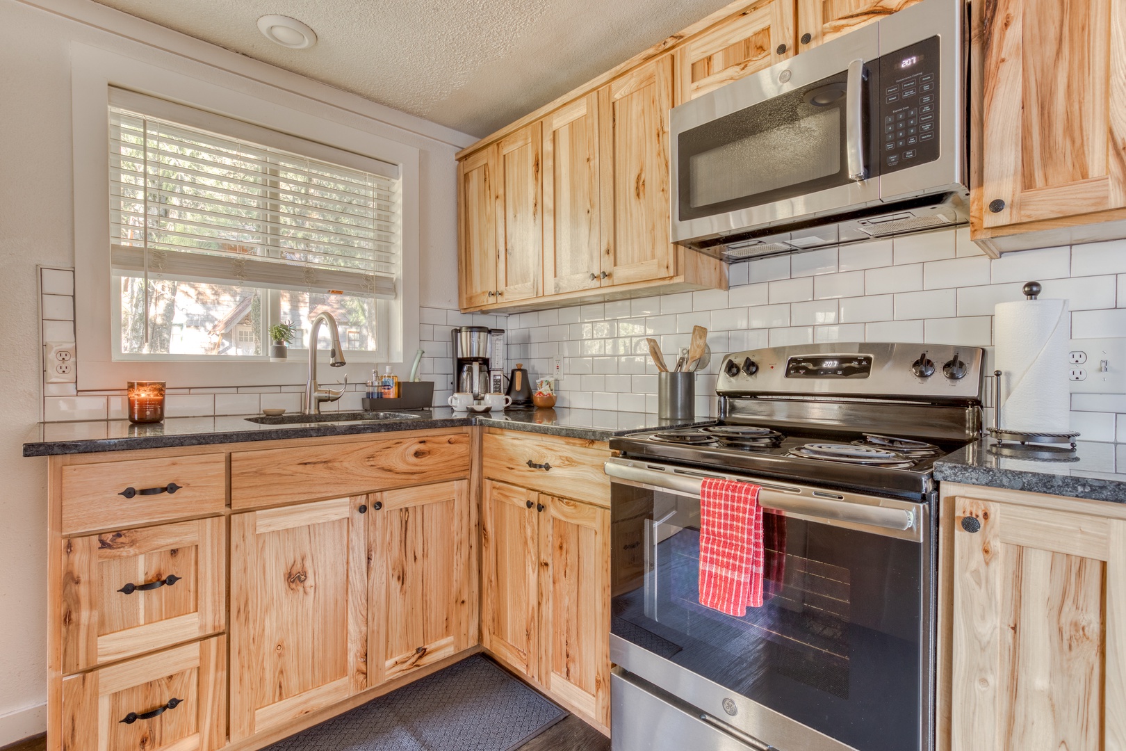 Rhododendron Vacation Rentals, Riverbend Cabin #1 - View of the backyard from the kitchen sink