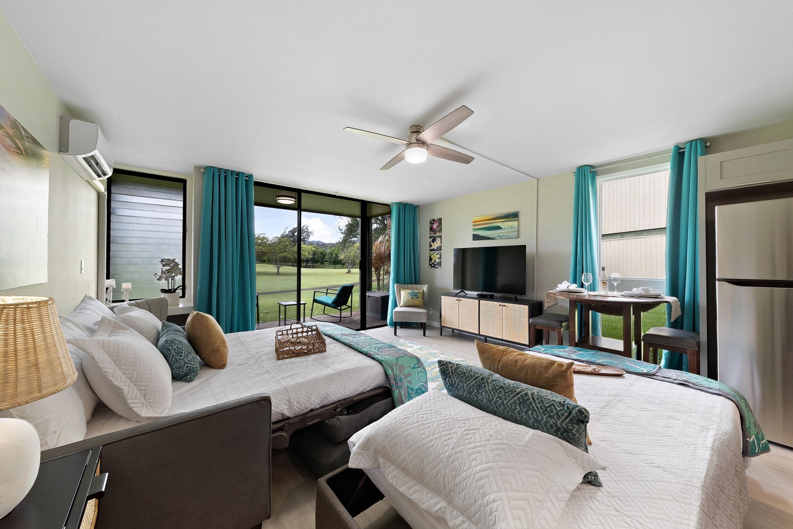Kahuku Vacation Rentals, Turtle Bay's Kuilima Estates West #104 - The living area has a queen sleeper sofa and twin ottoman sleeper