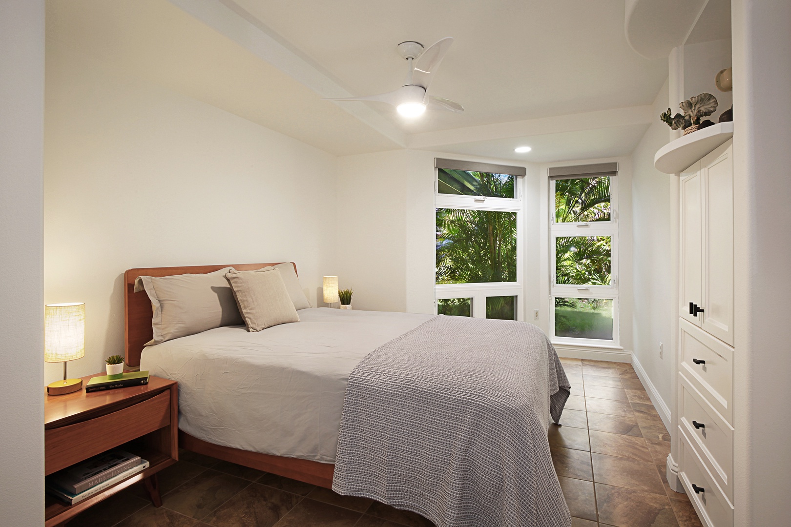 Princeville Vacation Rentals, Villas on the Prince #28 - Guest Bedroom has a king bed, ensuite bath, garden views, and split A/C