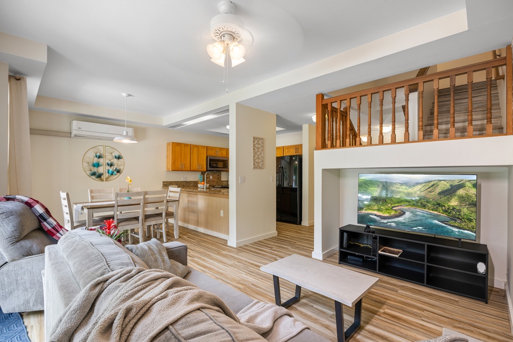 Relax in your spacious loft with cozy living area, full kitchen, and loft bedroom above—perfect for unwinding after exploring.