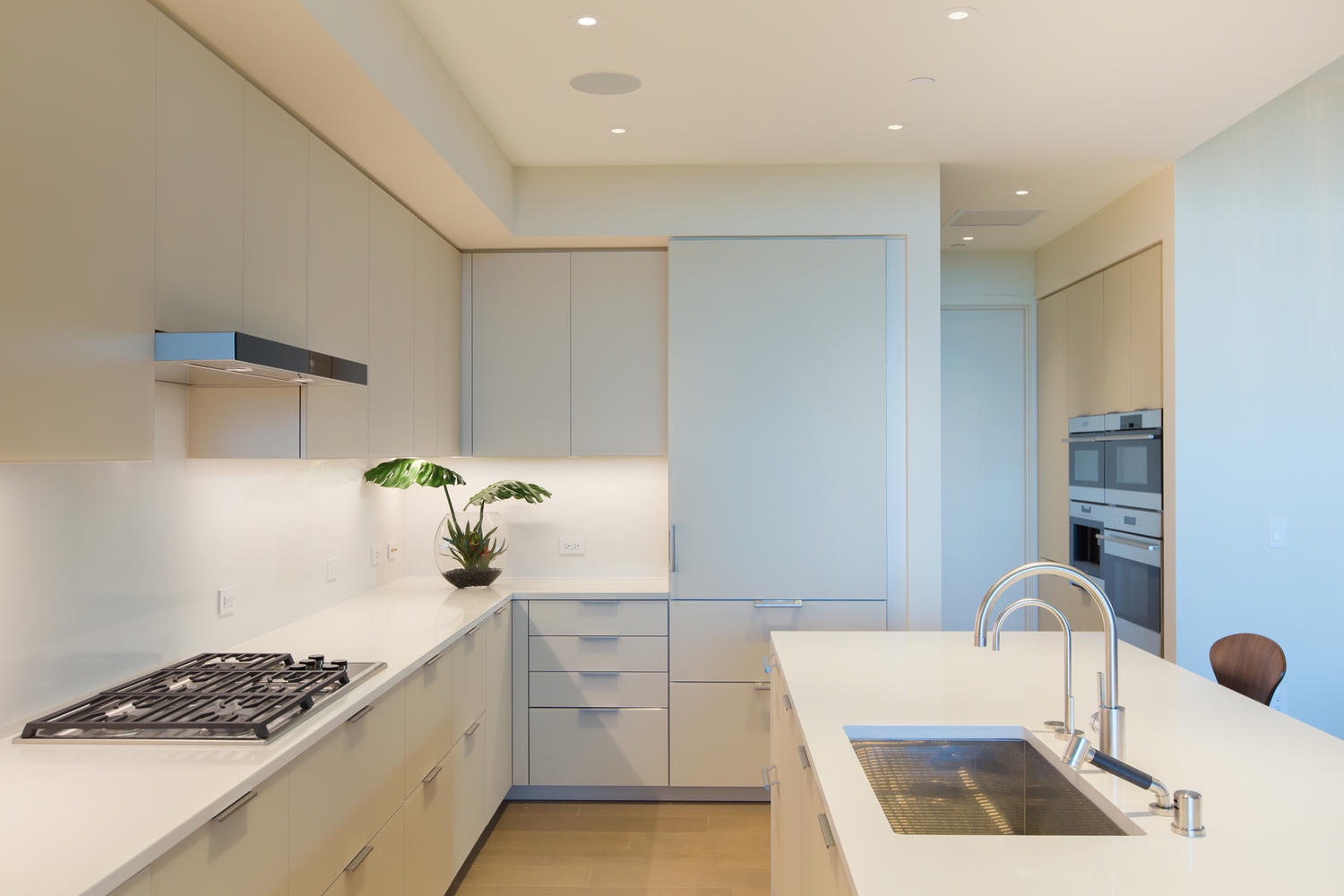 Honolulu Vacation Rentals, Park Lane Sunset Resort - Your sleek modern kitchen features premium appliances, pristine white counters, and thoughtful design for effortless meal preparation.