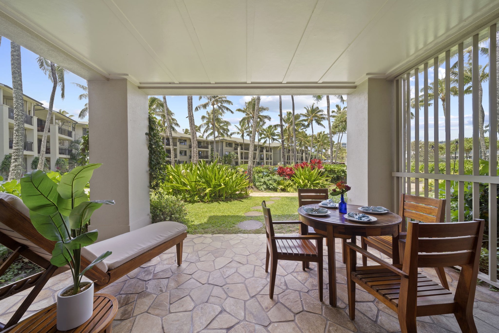 Kahuku Vacation Rentals, Turtle Bay Villas 114 - Garden lanai with outdoor dining set and chaise lounge
