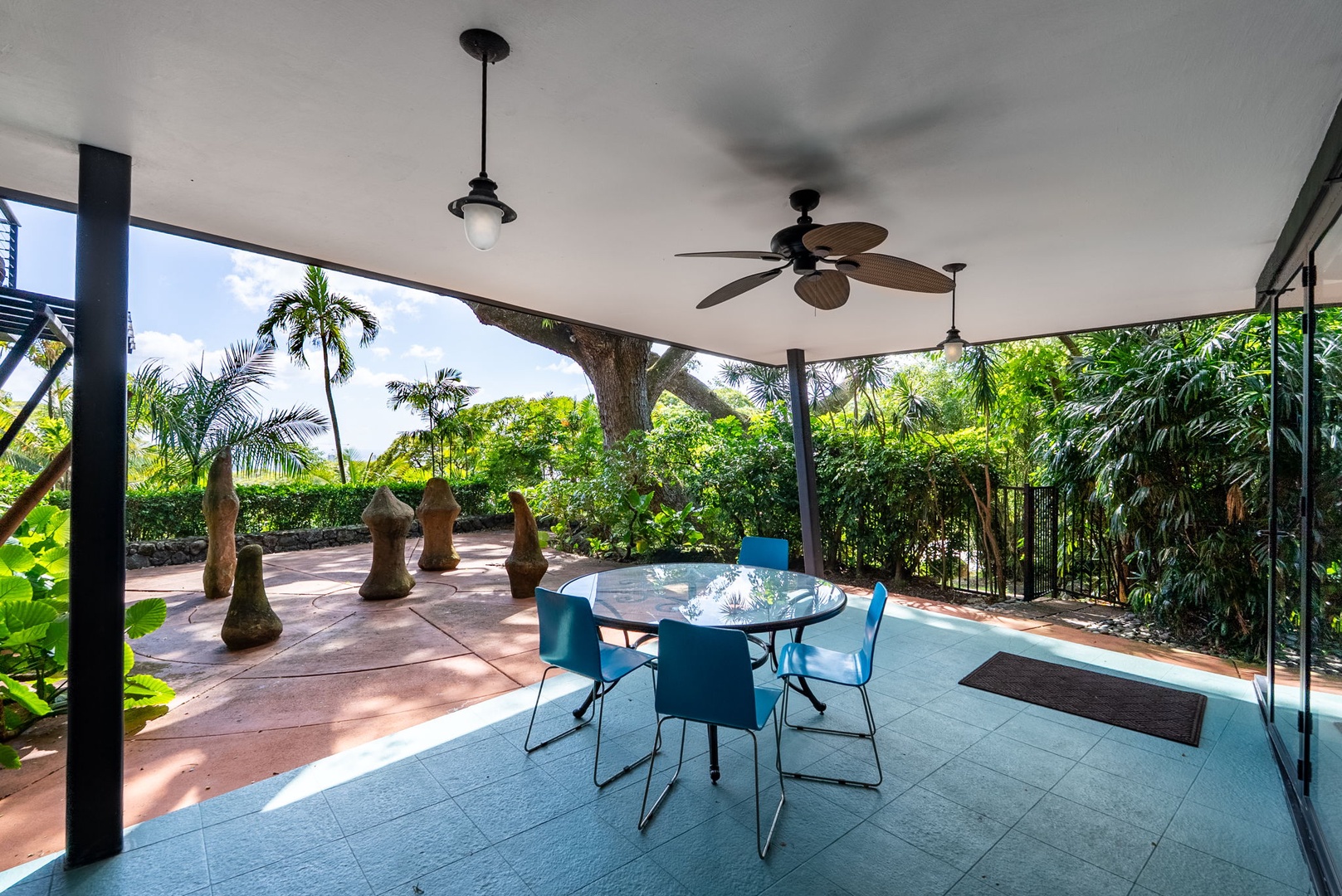 Honolulu Vacation Rentals, Tantalus Glass House (3 BD) - Relax in your private covered lanai with tropical garden views, perfect for outdoor dining under the ceiling fan's gentle breeze.